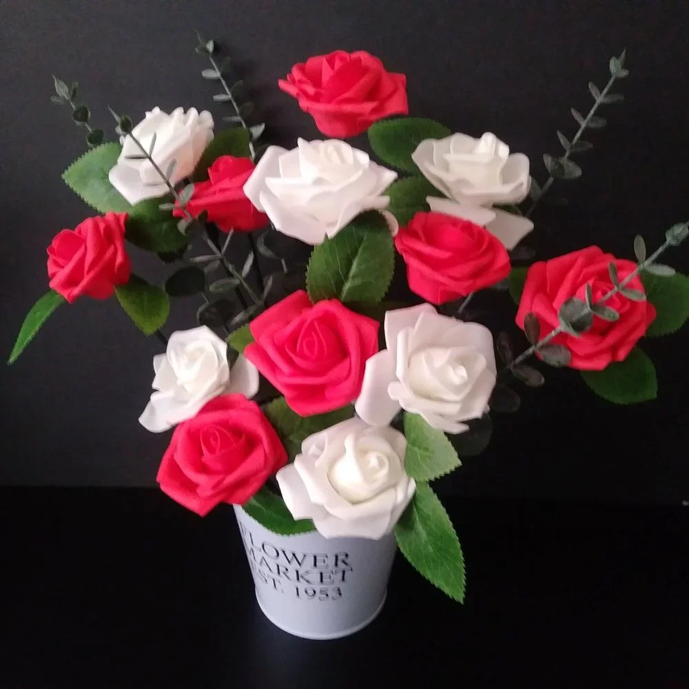 Bouquet of foam roses in red and white tones,